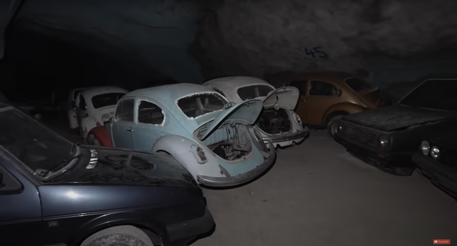 Abandoned classic Volkswagens in a mine